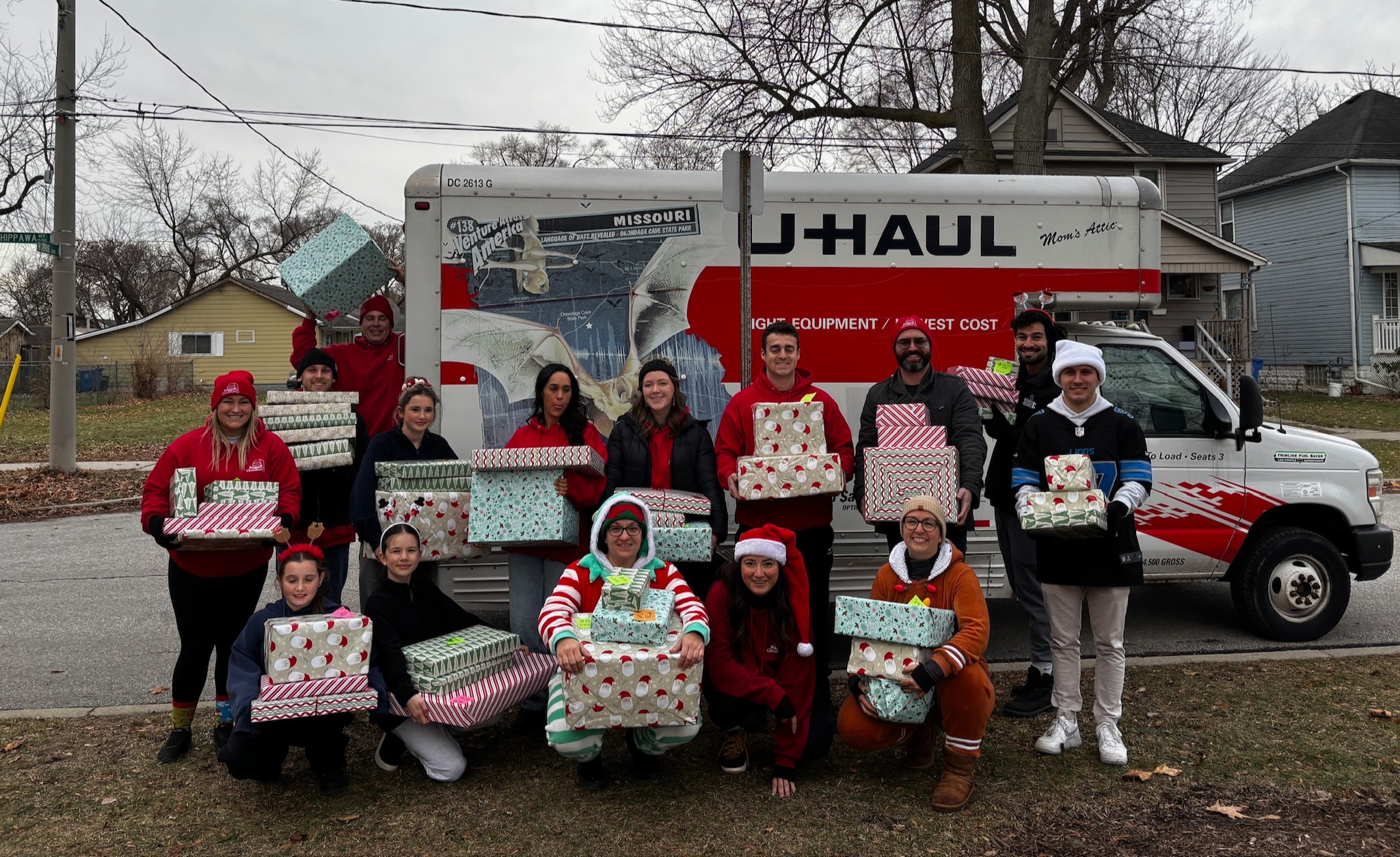 Project Christmas volunteers with gifts collected for local families